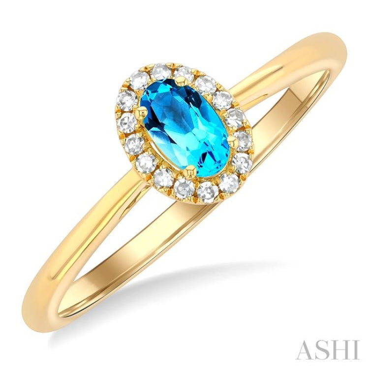 5x3 MM Oval Shape Blue Topaz and 1/20 Ctw Single Cut Diamond Halo Semi-Precious Ring in 14K Yellow Gold