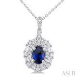 7x5 MM Oval Cut Sapphire and 5/8 Ctw Baguette & Round Cut Diamond Halo Precious Pendant With Chain in 14K White Gold