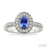 6x4mm Oval Cut Tanzanite and 1/4 Ctw Round Cut Diamond Ring in 14K White Gold