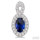 5x3 MM Oval Cut Sapphire and 1/5 ctw Round Cut Diamond Earrings in 14K White Gold