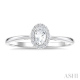 5x3 MM Oval Shape White Topaz and 1/20 Ctw Round Cut Diamond Halo Semi-Precious Ring in 10K White Gold