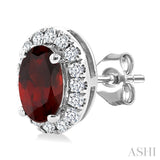 5x3 MM Oval Shape Garnet and 1/8 Ctw Round Cut Diamond Halo Semi-Precious Stud Earrings in 10K White Gold