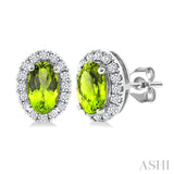 5x3 MM Oval Shape Peridot and 1/8 Ctw Round Cut Diamond Halo Semi-Precious Stud Earrings in 14K White Gold