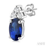 1/20 Ctw Oval Cut 5X3 MM Sapphire and Round Cut Diamond Precious Earrings in 10K White Gold