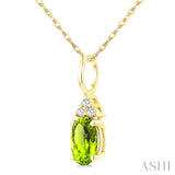 1/50 Ctw Oval Cut 6X4 MM Peridot and Round Cut Diamond Semi-Precious Pendant With Chain in 10K Yellow Gold