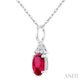 1/50 Ctw Oval Cut 6X4 MM Ruby and Round Cut Diamond Precious Pendant With Chain in 10K White Gold