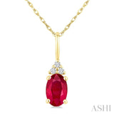 1/50 Ctw Oval Cut 6X4 MM Ruby and Round Cut Diamond Precious Pendant With Chain in 10K Yellow Gold