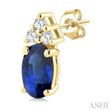 1/20 Ctw Oval Cut 5X3 MM Sapphire and Round Cut Diamond Precious Earrings in 10K Yellow Gold