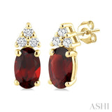 1/20 Ctw Oval Cut 5X3 MM Garnet and Round Cut Diamond semi-precious Earrings in 10K Yellow Gold