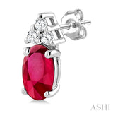 1/20 Ctw Oval Cut 5X3 MM Ruby and Round Cut Diamond Precious Earrings in 10K White Gold