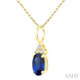1/50 Ctw Oval Cut 6X4 MM Sapphire and Round Cut Diamond Precious Pendant With Chain in 10K Yellow Gold