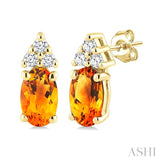 1/20 Ctw Oval Cut 5X3 MM Citrine and Round Cut Diamond semi-precious Earrings in 10K Yellow Gold