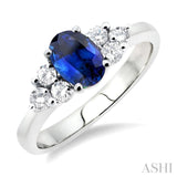 7x5mm Oval Cut Sapphire and 1/3 Ctw Round Cut Diamond Ring in 14K White Gold