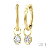 1/3 Ctw Bezel Set Oval Cut Diamond Huggie Earrings in 14K Yellow Gold